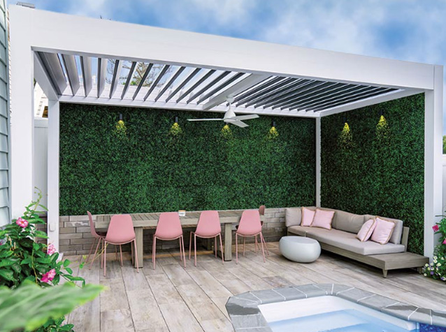 White pergola with green wall and fan on a pool deck - Azenco